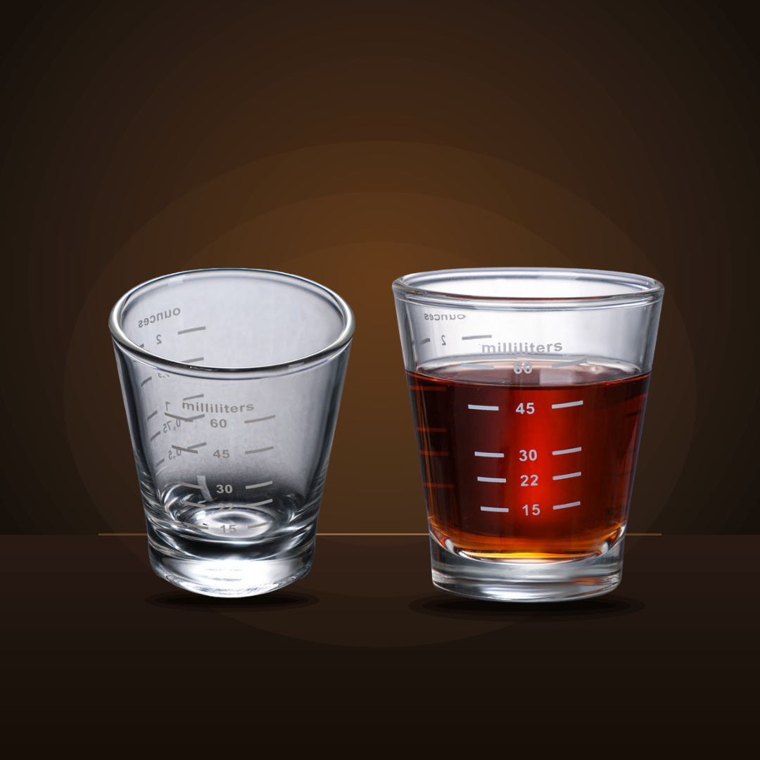 Espresso shot glass shown empty and filled with espresso, with printed measurement lines