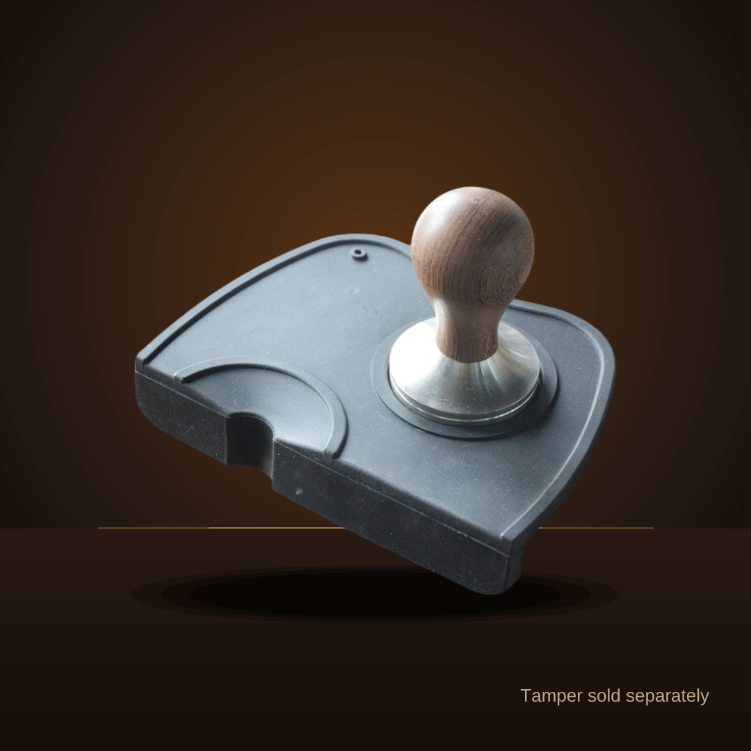 Black silicone tamping mat shown with a tamper (tamper sold separately)
