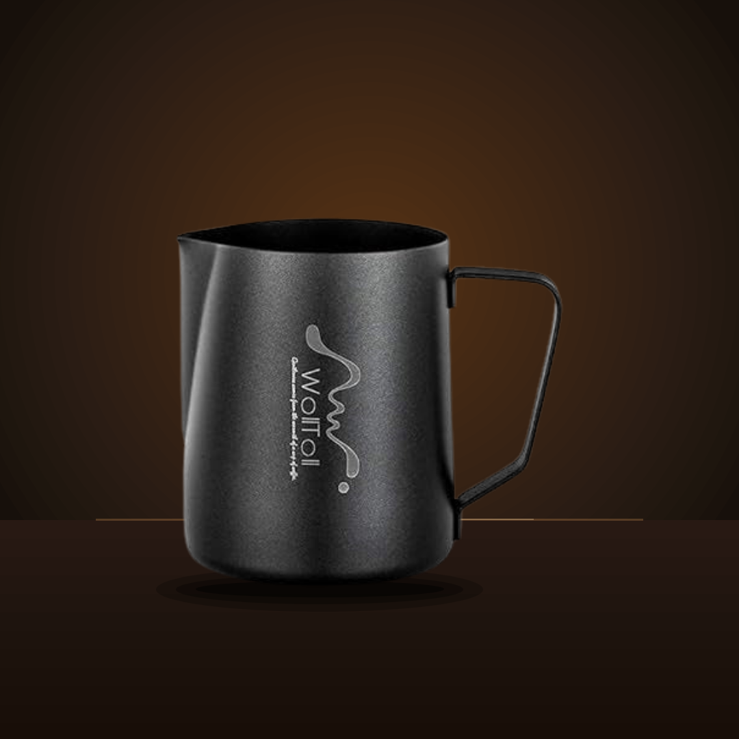 Side view of the matte black milk frothing pitcher showing the loop handle and spout