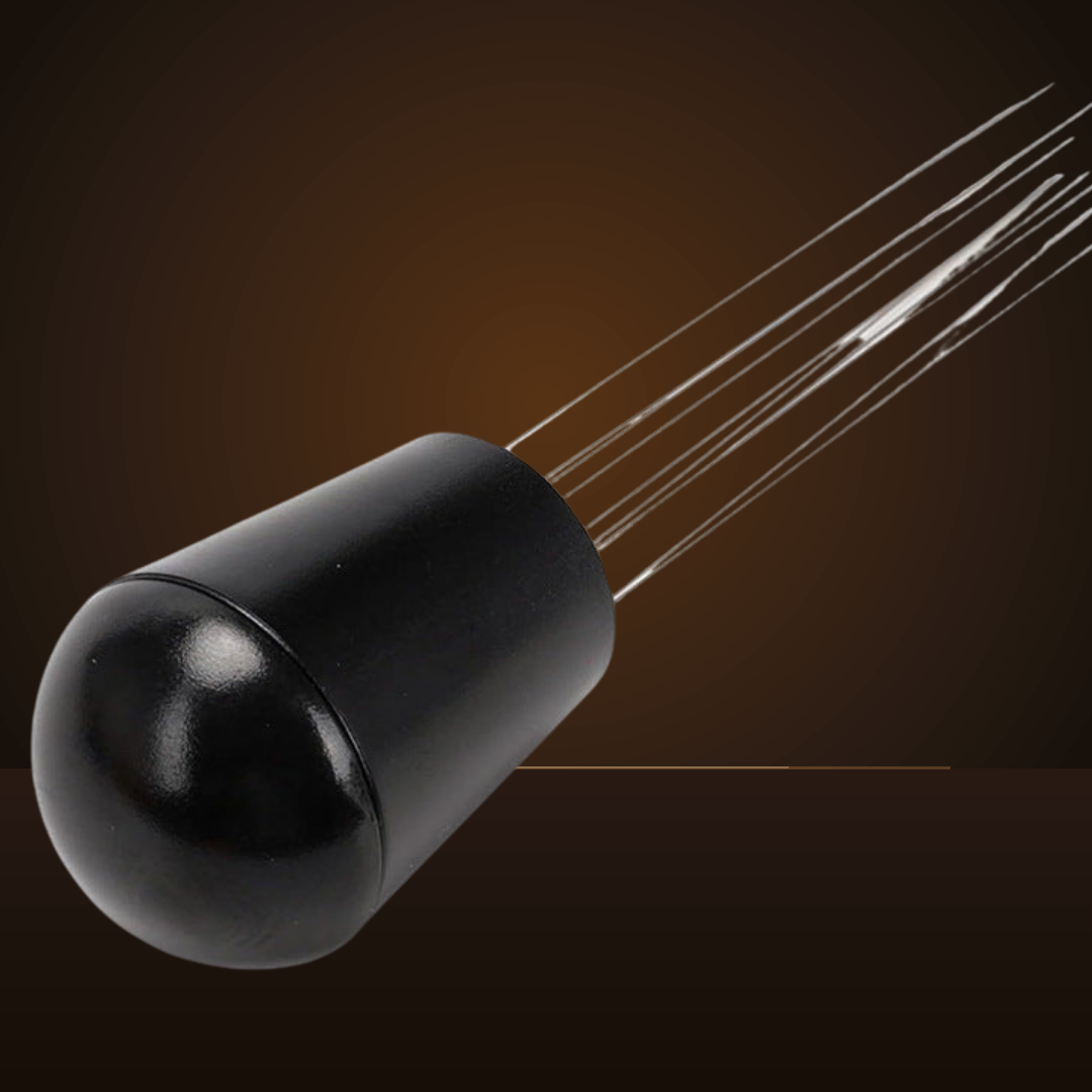 Close-up of the WDT tool's fine stainless steel needles and black knob
