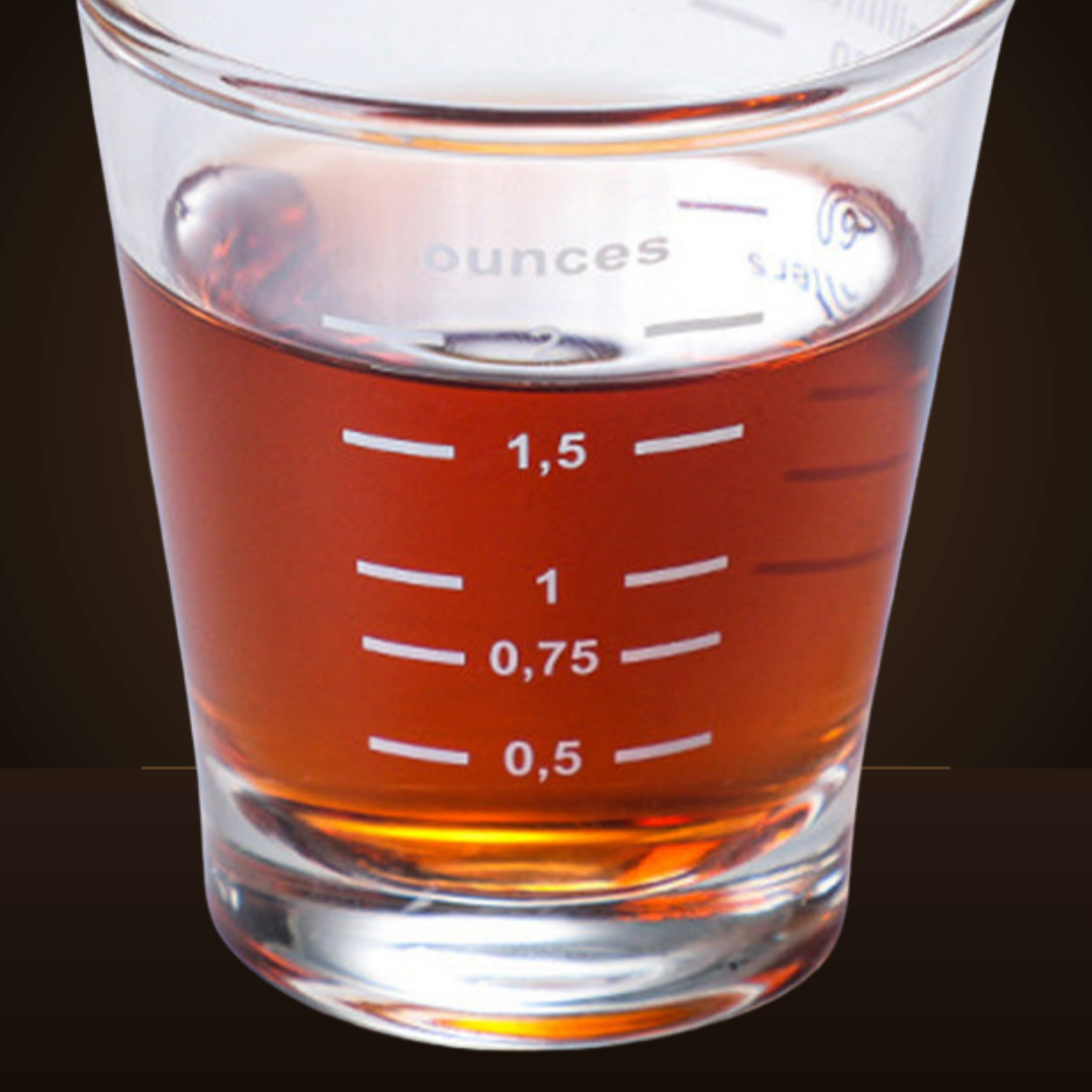 Close-up of the printed measurement lines on the espresso shot glass